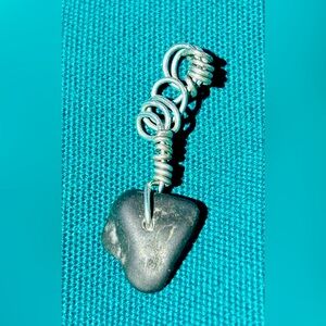 Hand wire wrapped natural finger lakes lucky stone pendant.